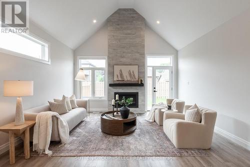 6 - 63 Compass Trail, Central Elgin (Port Stanley), ON - Indoor Photo Showing Living Room With Fireplace