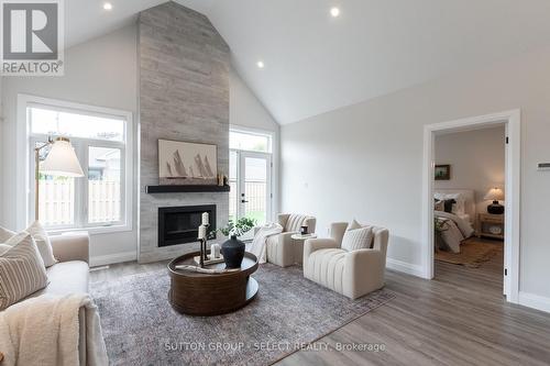 6 - 63 Compass Trail, Central Elgin (Port Stanley), ON - Indoor Photo Showing Living Room With Fireplace