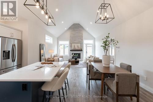 6 - 63 Compass Trail, Central Elgin (Port Stanley), ON - Indoor Photo Showing Dining Room With Fireplace