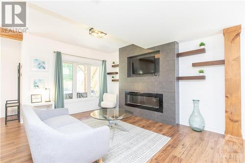 89 South Indian Drive, Limoges, ON - Indoor Photo Showing Living Room With Fireplace