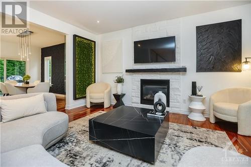 89 South Indian Drive, Limoges, ON - Indoor Photo Showing Living Room With Fireplace