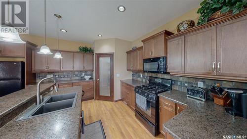 8247 Fairways West Drive, Regina, SK - Indoor Photo Showing Kitchen With Double Sink