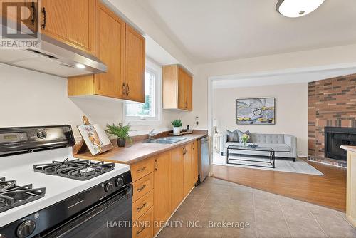 4855 Rathkeale Road, Mississauga, ON - Indoor Photo Showing Kitchen With Fireplace With Double Sink