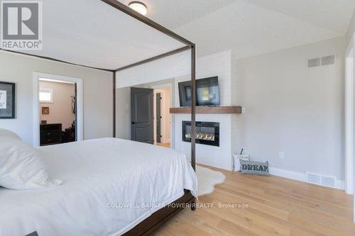 1056 Trailsway Avenue, London, ON - Indoor Photo Showing Bedroom With Fireplace