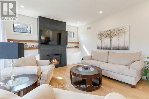 1056 Trailsway Avenue, London, ON - Indoor Photo Showing Living Room With Fireplace