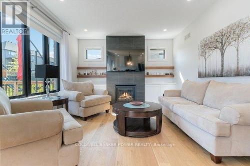 1056 Trailsway Avenue, London, ON - Indoor Photo Showing Living Room With Fireplace