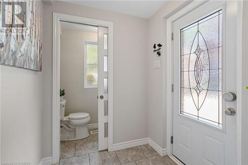 The stylish 2-piece bathroom on the main floor offers a chic and accessible space for guests and everyday use. - 1371 3Rd Avenue E, Owen Sound, ON - Indoor