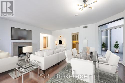 2122 - 20 Blue Jays Way, Toronto, ON - Indoor Photo Showing Living Room With Fireplace