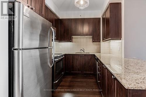 607 - 24 Woodstream Boulevard N, Vaughan (Vaughan Grove), ON - Indoor Photo Showing Kitchen With Stainless Steel Kitchen With Double Sink With Upgraded Kitchen