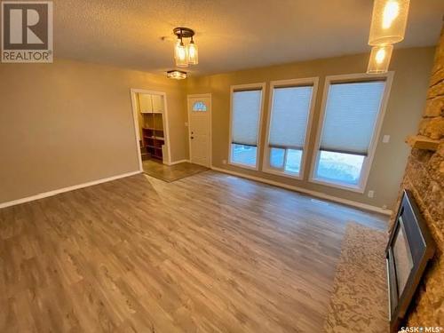 153 Logan Crescent W, Yorkton, SK - Indoor Photo Showing Other Room With Fireplace