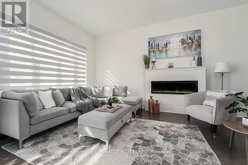 32 Dotchson Avenue, Caledon, ON - Indoor Photo Showing Living Room With Fireplace