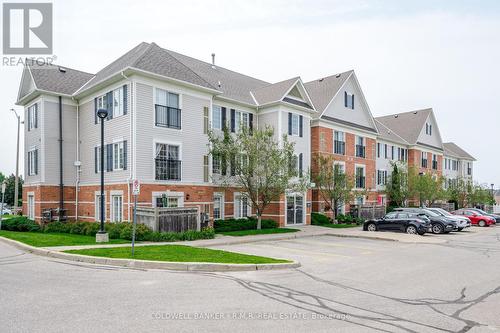 209 - 106 Aspen Springs Drive, Clarington (Bowmanville), ON - Outdoor With Facade