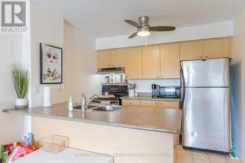 209 - 106 Aspen Springs Drive, Clarington (Bowmanville), ON - Indoor Photo Showing Kitchen With Double Sink