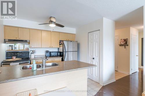 209 - 106 Aspen Springs Drive, Clarington (Bowmanville), ON - Indoor Photo Showing Kitchen With Double Sink