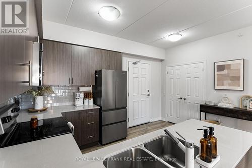 218 - 290 Liberty Street N, Clarington (Bowmanville), ON - Indoor Photo Showing Kitchen With Stainless Steel Kitchen With Double Sink