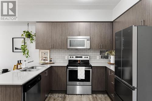 218 - 290 Liberty Street N, Clarington (Bowmanville), ON - Indoor Photo Showing Kitchen With Stainless Steel Kitchen With Double Sink With Upgraded Kitchen