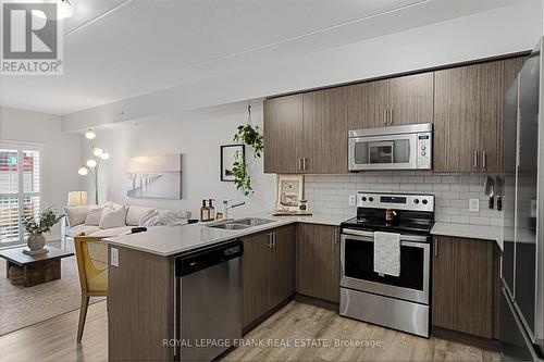 218 - 290 Liberty Street N, Clarington (Bowmanville), ON - Indoor Photo Showing Kitchen With Stainless Steel Kitchen With Double Sink With Upgraded Kitchen