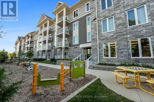 218 - 290 Liberty Street N, Clarington (Bowmanville), ON - Outdoor With Balcony With Facade