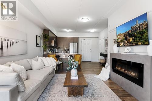 218 - 290 Liberty Street N, Clarington (Bowmanville), ON - Indoor Photo Showing Living Room With Fireplace