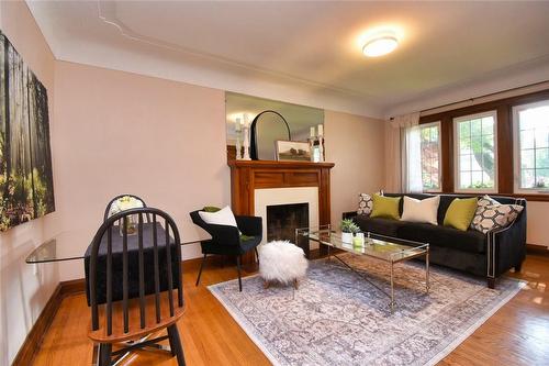 Living/Dining - 122 Haddon Avenue S, Hamilton, ON - Indoor Photo Showing Living Room With Fireplace