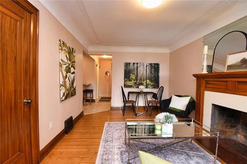 122 Haddon Avenue S, Hamilton, ON - Indoor Photo Showing Living Room With Fireplace