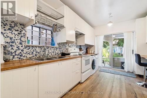 8 Beaver Avenue, Toronto (Dovercourt-Wallace Emerson-Junction), ON - Indoor Photo Showing Kitchen With Double Sink