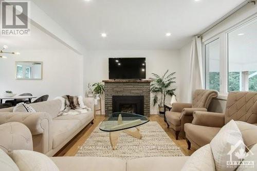 1463 Meadow Drive, Ottawa, ON - Indoor Photo Showing Living Room With Fireplace