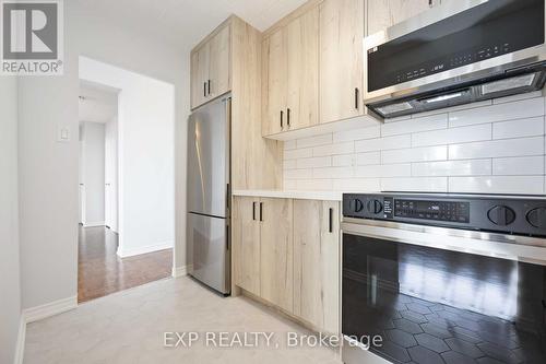 507 - 3621 Lake Shore Boulevard W, Toronto (Long Branch), ON - Indoor Photo Showing Kitchen With Stainless Steel Kitchen