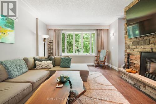 9 Green Pine Avenue, Springwater (Midhurst), ON - Indoor Photo Showing Living Room With Fireplace