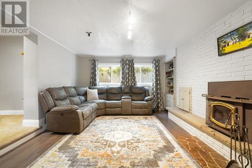 9 Green Pine Avenue, Springwater (Midhurst), ON - Indoor Photo Showing Living Room With Fireplace