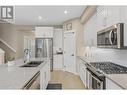 9563 Jensen Road Unit# 403, Lake Country, BC  - Indoor Photo Showing Kitchen With Double Sink With Upgraded Kitchen 