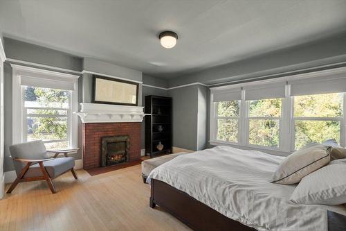 9 Park Crescent, Fernie, BC - Indoor Photo Showing Bedroom With Fireplace