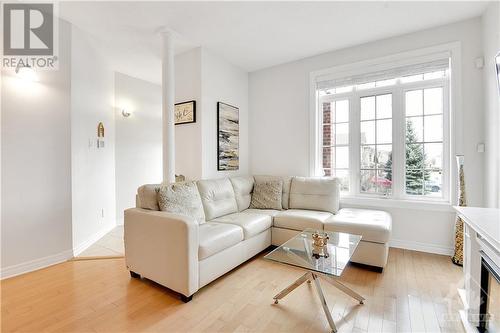 The Open plan main floor enjoys Transom Windows and 9' ceiling. - 330 Royal Fern Way, Ottawa, ON - Indoor Photo Showing Living Room