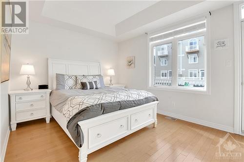 The primary Bedroom located on Main Level features a Tray Ceiling - 330 Royal Fern Way, Ottawa, ON - Indoor Photo Showing Bedroom