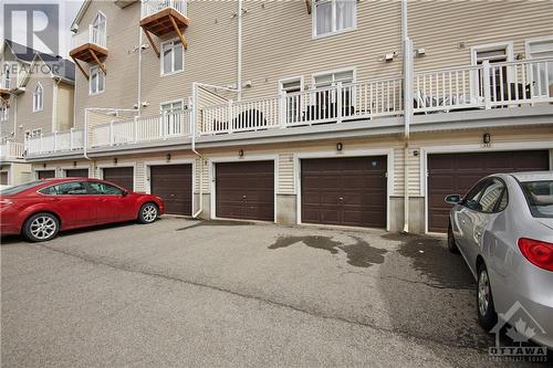 The additional surface Parking behind the garage allows for extra parking including overnight parking for your guests during winter. - 330 Royal Fern Way, Ottawa, ON - Outdoor With Exterior