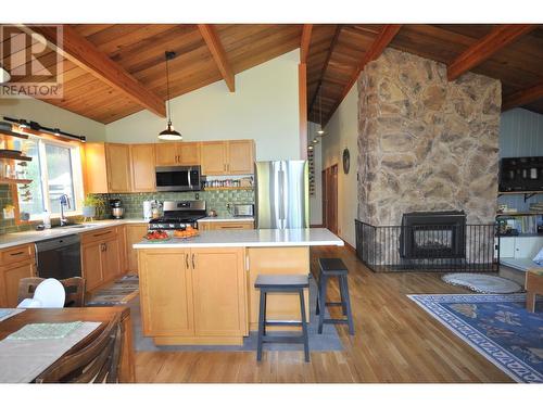 1710 South Lakeside Drive, Williams Lake, BC - Indoor Photo Showing Kitchen With Fireplace With Double Sink