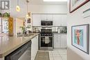 112 - 310 Red Maple Road, Richmond Hill, ON  - Indoor Photo Showing Kitchen With Double Sink 