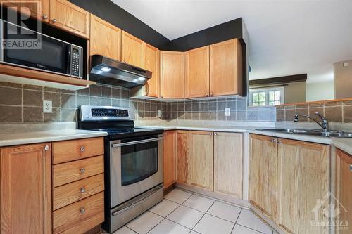 Tons of Cabinet Space in the Chef's Kitchen! - 14 Carwood Circle, Ottawa, ON - Indoor Photo Showing Kitchen With Double Sink