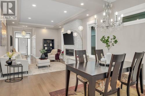 3039 Burtch Road, Kelowna, BC - Indoor Photo Showing Dining Room With Fireplace