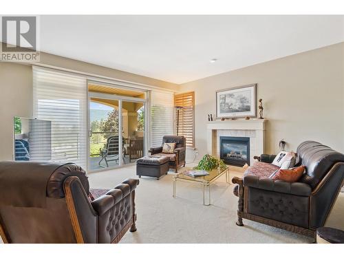 2259 Capistrano Drive, Kelowna, BC - Indoor Photo Showing Living Room With Fireplace