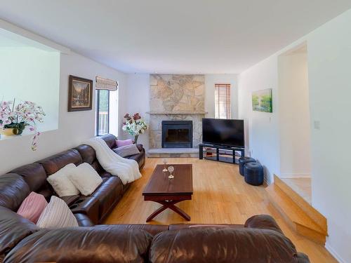 Salle familiale - 1075 Rue Renoir, Brossard, QC - Indoor Photo Showing Living Room With Fireplace