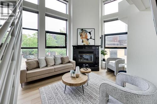 202 - 393 King Street E, Toronto (Moss Park), ON - Indoor Photo Showing Living Room With Fireplace