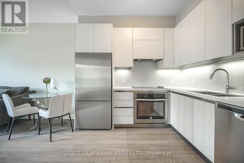 311 - 15 Water Walk Drive, Markham (Unionville), ON - Indoor Photo Showing Kitchen With Stainless Steel Kitchen With Double Sink