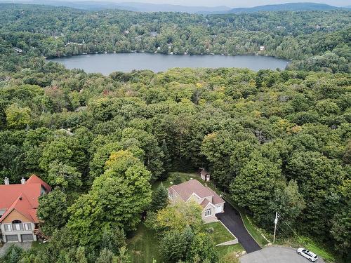 Photo aÃ©rienne - 94 Ch. Des Loriots, Sainte-Anne-Des-Lacs, QC - Outdoor With Body Of Water With View