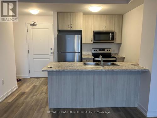 1204 - 470 Dundas Street E, Hamilton (Waterdown), ON - Indoor Photo Showing Kitchen With Stainless Steel Kitchen With Double Sink With Upgraded Kitchen