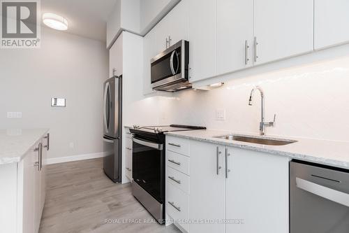 2205 - 3220 William Coltson Avenue, Oakville, ON - Indoor Photo Showing Kitchen With Upgraded Kitchen