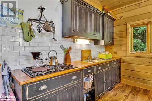 Propane stove top - 1880 Boldts Lane, Minden Hills, ON - Indoor Photo Showing Kitchen With Double Sink