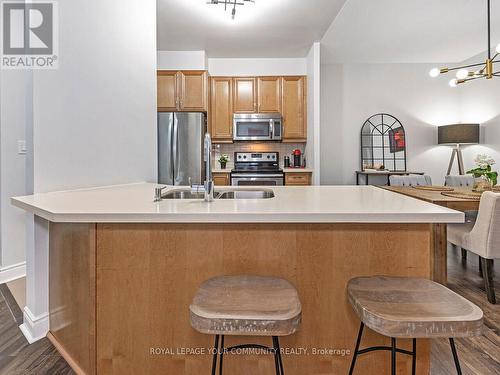 114 - 25 Earlington Avenue, Toronto (Kingsway South), ON - Indoor Photo Showing Kitchen With Stainless Steel Kitchen With Double Sink