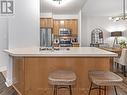 114 - 25 Earlington Avenue, Toronto (Kingsway South), ON  - Indoor Photo Showing Kitchen With Stainless Steel Kitchen With Double Sink 