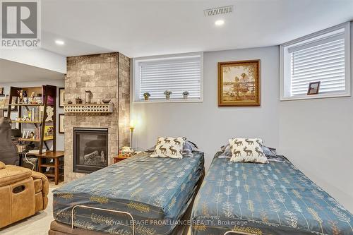 25 Brinton Drive, Peterborough (Otonabee), ON - Indoor Photo Showing Bedroom With Fireplace